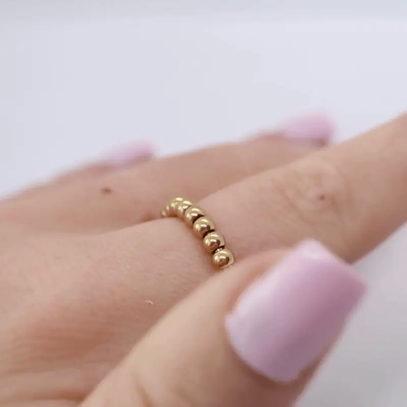 Anxiety Ring goud kleurig (RVS) one size in beweging